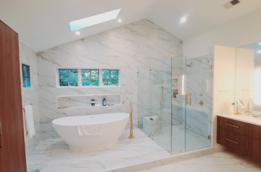 Home Modern bathroom remodeling with freestanding bathtub, marble tile walls, and frameless glass walk-in shower sky light